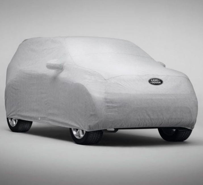 Copriauto impermeabile Land Rover tutte le stagioni, componente OEM VPLCC0103, mostra il tessuto resistente e il design adattabile.