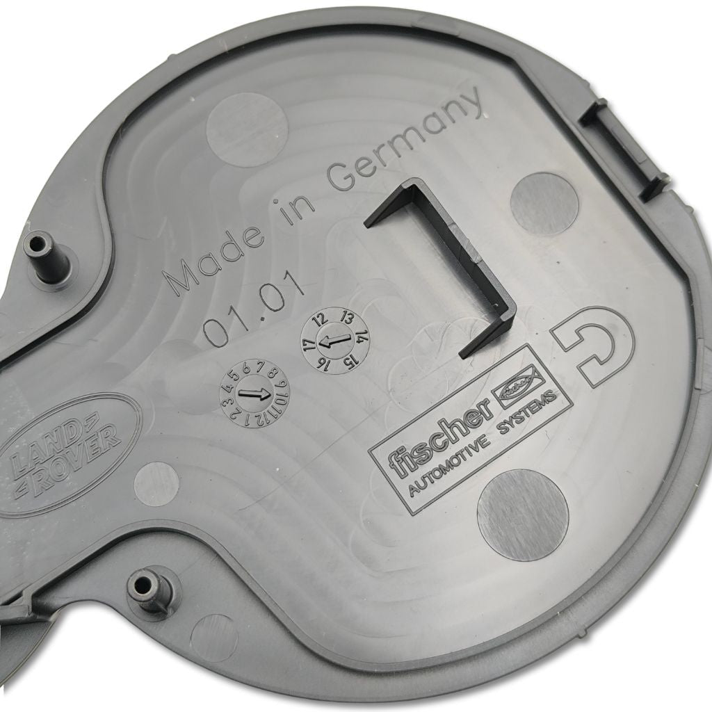 Inserto copertura portabicchieri centrale Land Rover OEM LR039561, componente originale in plastica per interni auto.