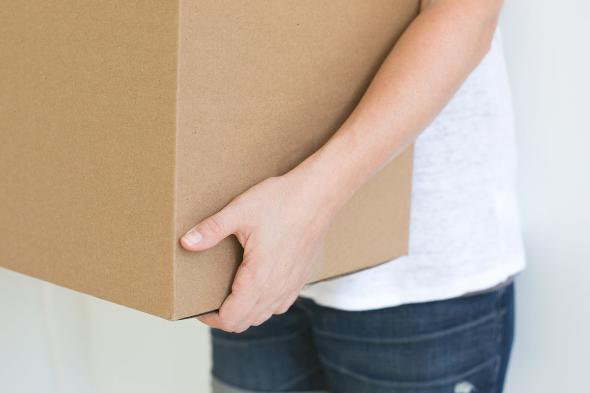 Person holding box
